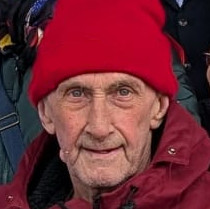 A photo of Dave, who is wearing a red hat.